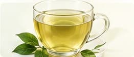 A glass cup of green tea